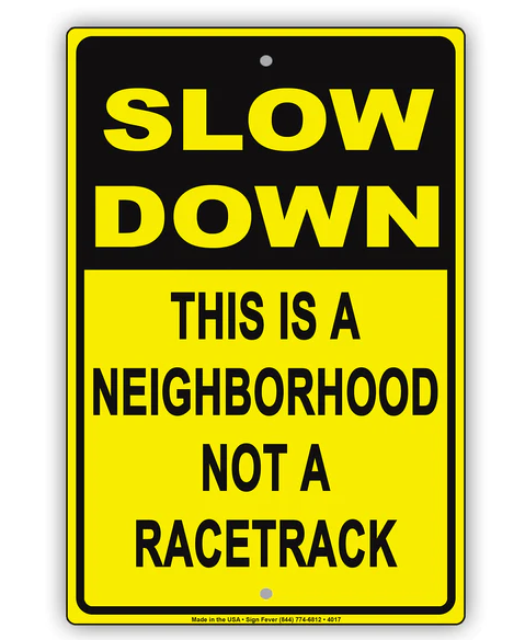 Slow Down This Is A Neighborhood Not A Racetrack Sign 12 x 18